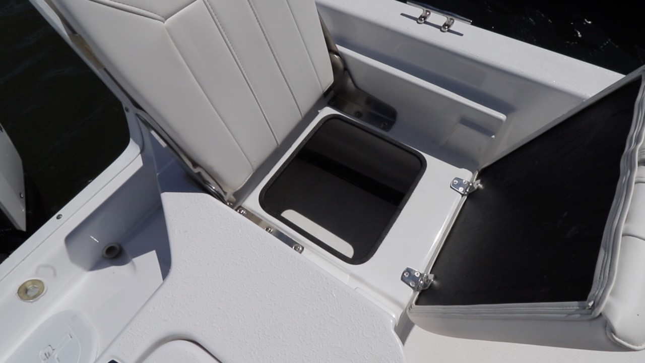 Port side jump seat storage